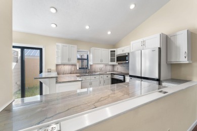 Enjoy peaceful lake views from this well-maintained 3-bedroom on Heritage Ridge Golf Club in Florida - for sale on GolfHomes.com, golf home, golf lot