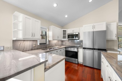 Enjoy peaceful lake views from this well-maintained 3-bedroom on Heritage Ridge Golf Club in Florida - for sale on GolfHomes.com, golf home, golf lot