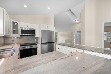 Enjoy peaceful lake views from this well-maintained 3-bedroom on Heritage Ridge Golf Club in Florida - for sale on GolfHomes.com, golf home, golf lot