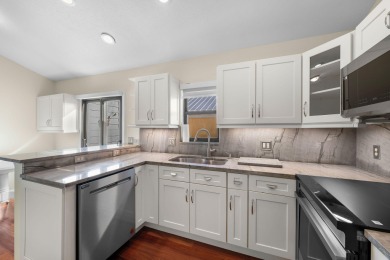 Enjoy peaceful lake views from this well-maintained 3-bedroom on Heritage Ridge Golf Club in Florida - for sale on GolfHomes.com, golf home, golf lot