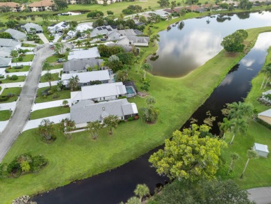 Enjoy peaceful lake views from this well-maintained 3-bedroom on Heritage Ridge Golf Club in Florida - for sale on GolfHomes.com, golf home, golf lot