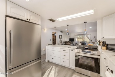 Enjoy relaxed living in this charming patio home positioned on Fountain of the Sun Country Club in Arizona - for sale on GolfHomes.com, golf home, golf lot