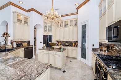 Welcome to 7409 Gathering Ct, a fully remodeled Mediterranean on  in Florida - for sale on GolfHomes.com, golf home, golf lot