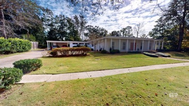 Welcome to this stunning Mid-Century home, a rare find in Yester on Spring Hill College Golf Course in Alabama - for sale on GolfHomes.com, golf home, golf lot