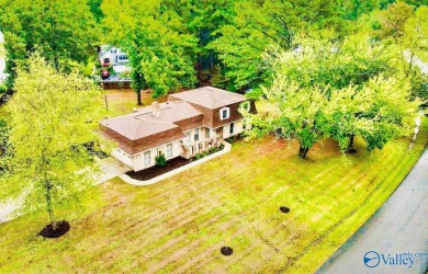 A Stunning 4 bedroom home that sits on an oversized corner lot on Burningtree Country Club in Alabama - for sale on GolfHomes.com, golf home, golf lot