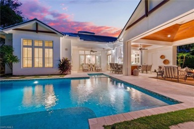 In the heart of the Moorings sits a picture-perfect single story on The Moorings Country Club in Florida - for sale on GolfHomes.com, golf home, golf lot