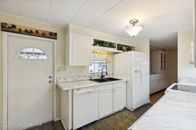 Welcome to Barefoot Bay! This 2 bedroom, 2 bath home is walking on Barefoot Bay Golf Course in Florida - for sale on GolfHomes.com, golf home, golf lot