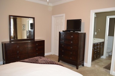 Beautiful home in quaint, white-picket-fenced, gated community on Fairway Oaks at Magnolia Golf Course in Florida - for sale on GolfHomes.com, golf home, golf lot