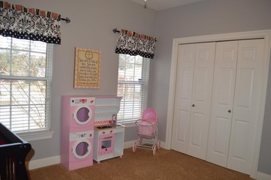 Beautiful home in quaint, white-picket-fenced, gated community on Fairway Oaks at Magnolia Golf Course in Florida - for sale on GolfHomes.com, golf home, golf lot