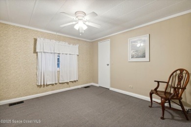 Welcome to Barefoot Bay! This 2 bedroom, 2 bath home is walking on Barefoot Bay Golf Course in Florida - for sale on GolfHomes.com, golf home, golf lot