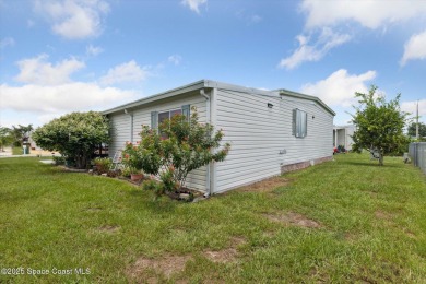 Welcome to Barefoot Bay! This 2 bedroom, 2 bath home is walking on Barefoot Bay Golf Course in Florida - for sale on GolfHomes.com, golf home, golf lot