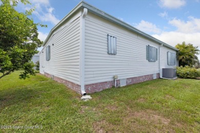 Welcome to Barefoot Bay! This 2 bedroom, 2 bath home is walking on Barefoot Bay Golf Course in Florida - for sale on GolfHomes.com, golf home, golf lot