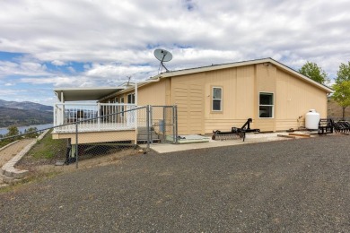 **Stunning Three-Bedroom Home on Lake Roosevelt!**  Discover on Deer Meadows Golf Course in Washington - for sale on GolfHomes.com, golf home, golf lot