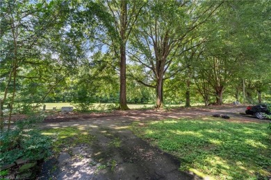 Spacious 4 Bedroom 3 Bath, Two Bedrooms with two full baths on on Heather Hills Golf Course in North Carolina - for sale on GolfHomes.com, golf home, golf lot
