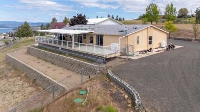 **Stunning Three-Bedroom Home on Lake Roosevelt!**  Discover on Deer Meadows Golf Course in Washington - for sale on GolfHomes.com, golf home, golf lot