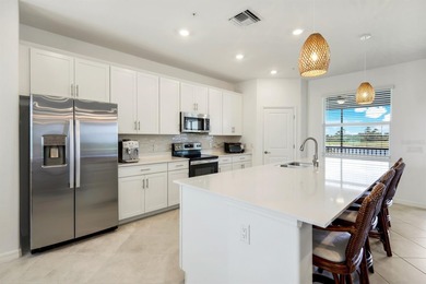 Beautiful Lakefront Coach Home with Golf Course Views! With over on Heritage Landing Golf  in Florida - for sale on GolfHomes.com, golf home, golf lot