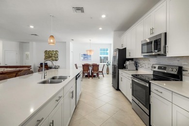 Beautiful Lakefront Coach Home with Golf Course Views! With over on Heritage Landing Golf  in Florida - for sale on GolfHomes.com, golf home, golf lot