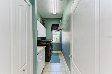 Welcome to this beautifully updated 4-bedroom, 3-bathroom home on Misty Creek Country Club in Florida - for sale on GolfHomes.com, golf home, golf lot