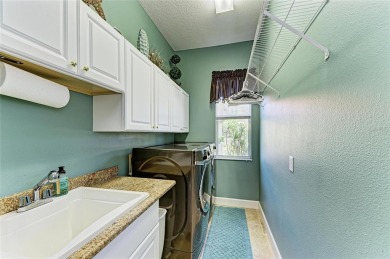Welcome to this beautifully updated 4-bedroom, 3-bathroom home on Misty Creek Country Club in Florida - for sale on GolfHomes.com, golf home, golf lot