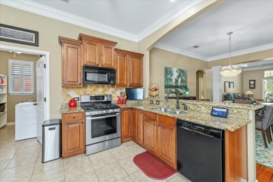 Large luxurious townhome in the esteemed gated Golden Eagle golf on Golden Eagle Country Club in Florida - for sale on GolfHomes.com, golf home, golf lot