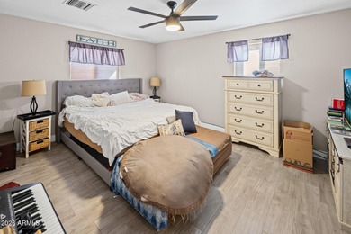 Nestled in a highly desirable central neighborhood, this on London Bridge Golf Course in Arizona - for sale on GolfHomes.com, golf home, golf lot