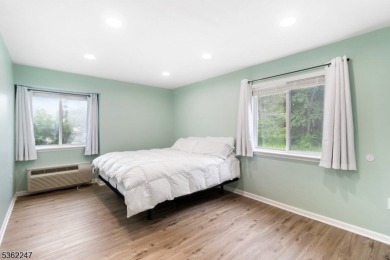 Flooded with natural light, this bright and airy end-unit condo on Quail Brook Golf Course in New Jersey - for sale on GolfHomes.com, golf home, golf lot