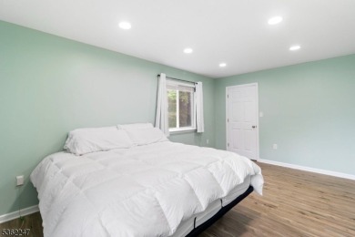 Flooded with natural light, this bright and airy end-unit condo on Quail Brook Golf Course in New Jersey - for sale on GolfHomes.com, golf home, golf lot