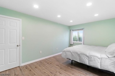 Flooded with natural light, this bright and airy end-unit condo on Quail Brook Golf Course in New Jersey - for sale on GolfHomes.com, golf home, golf lot