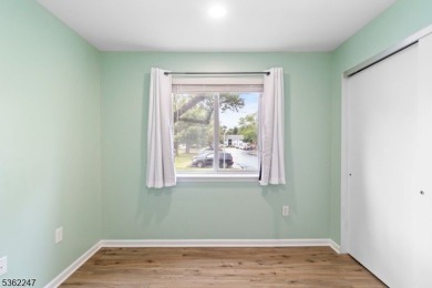 Flooded with natural light, this bright and airy end-unit condo on Quail Brook Golf Course in New Jersey - for sale on GolfHomes.com, golf home, golf lot