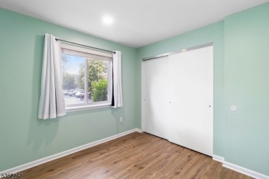 Flooded with natural light, this bright and airy end-unit condo on Quail Brook Golf Course in New Jersey - for sale on GolfHomes.com, golf home, golf lot