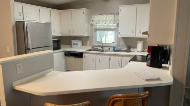 This 2 bedroom/2 bath home is 1204 sq ft. of living space, plus on Sabal Springs Golf and Racquet Club in Florida - for sale on GolfHomes.com, golf home, golf lot