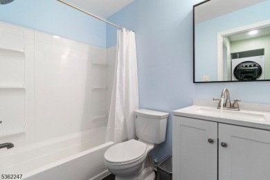 Flooded with natural light, this bright and airy end-unit condo on Quail Brook Golf Course in New Jersey - for sale on GolfHomes.com, golf home, golf lot