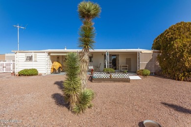 Great curb appeal to this partially furnished split floorplan 2 on Fountain of the Sun Country Club in Arizona - for sale on GolfHomes.com, golf home, golf lot