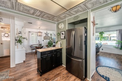 This charming and well-maintained, recently updated 2-bedroom on Fountain of the Sun Country Club in Arizona - for sale on GolfHomes.com, golf home, golf lot