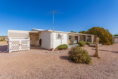 Great curb appeal to this partially furnished split floorplan 2 on Fountain of the Sun Country Club in Arizona - for sale on GolfHomes.com, golf home, golf lot