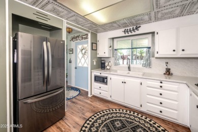 This charming and well-maintained, recently updated 2-bedroom on Fountain of the Sun Country Club in Arizona - for sale on GolfHomes.com, golf home, golf lot