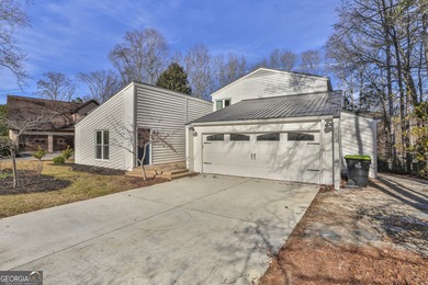 Welcome to this beautifully updated 4-bedroom home perfectly on Canongate At Flat Creek Club in Georgia - for sale on GolfHomes.com, golf home, golf lot