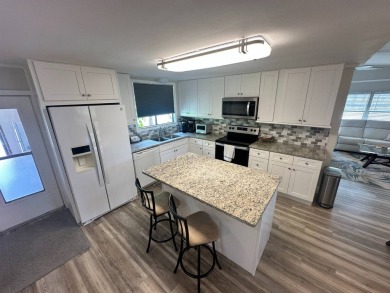 Lot Rent $1342.00    This well cared for 2 bedrooms, 2 bathrooms on Del Tura Golf and Country Club in Florida - for sale on GolfHomes.com, golf home, golf lot