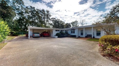 Welcome to this stunning Mid-Century home, a rare find in Yester on Spring Hill College Golf Course in Alabama - for sale on GolfHomes.com, golf home, golf lot