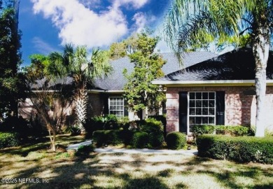 Prepare to be captivated by this exquisite 4-bedroom, 3-bath on Hidden Hills Country Club in Florida - for sale on GolfHomes.com, golf home, golf lot