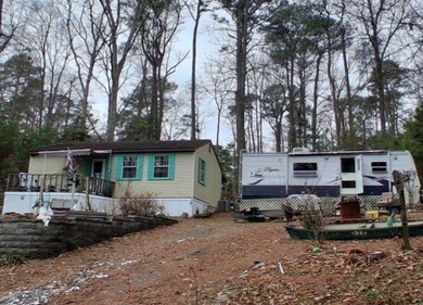 The Perfect coastal retreat in Trails End Seaside Community on Captains Cove Golf and Yacht Club in Virginia - for sale on GolfHomes.com, golf home, golf lot