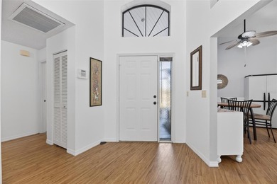 Step into this beautifully maintained 2-bedroom, 2-bath home on Sandpiper Golf Club in Florida - for sale on GolfHomes.com, golf home, golf lot