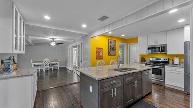 Under contract-accepting backup offers. This 4-bedroom, 2.5-bath on Cleveland Heights Golf Course in Florida - for sale on GolfHomes.com, golf home, golf lot