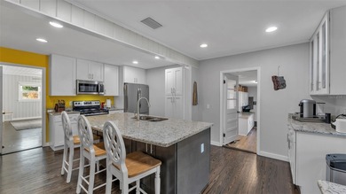 Under contract-accepting backup offers. This 4-bedroom, 2.5-bath on Cleveland Heights Golf Course in Florida - for sale on GolfHomes.com, golf home, golf lot