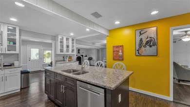 Under contract-accepting backup offers. This 4-bedroom, 2.5-bath on Cleveland Heights Golf Course in Florida - for sale on GolfHomes.com, golf home, golf lot