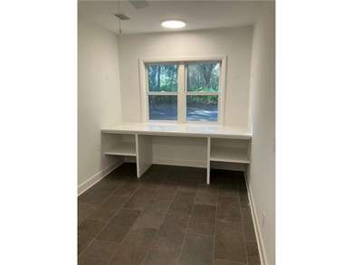 Over 1500 sq feet in the larger side of this two family dwelling on Jekyll Island Golf Club in Georgia - for sale on GolfHomes.com, golf home, golf lot