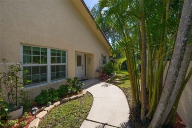 Find paradise in this elegantly updated, bright & airy 2bed on Delray Beach Golf Club in Florida - for sale on GolfHomes.com, golf home, golf lot