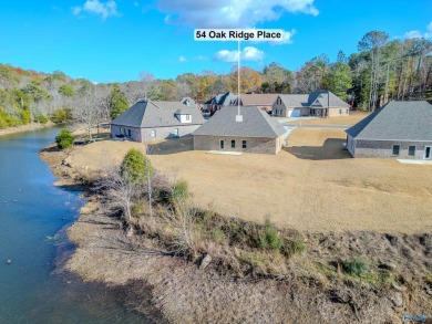 FULL BRICK HOUSE WITH WATER ACCESS IN BACKYARD.   SURROUNDED BY on Cherokee Ridge Country Club in Alabama - for sale on GolfHomes.com, golf home, golf lot