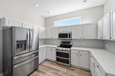 Discover your slice of paradise in the coveted Greenfield on Links At Greenfield Plantation in Florida - for sale on GolfHomes.com, golf home, golf lot