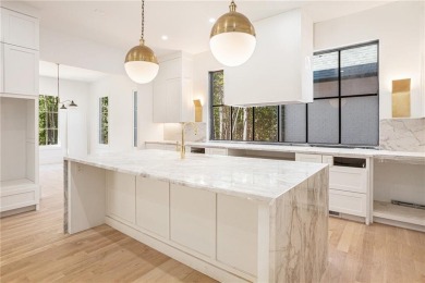 Set on a sprawling 1-acre lot in an established, tree-lined on Dunwoody Country Club in Georgia - for sale on GolfHomes.com, golf home, golf lot